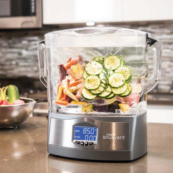Sousvant Sous Vide Circulator SV-101 with Cucumbers, Carrots, Rosemary, and Potatoes - Tribest
